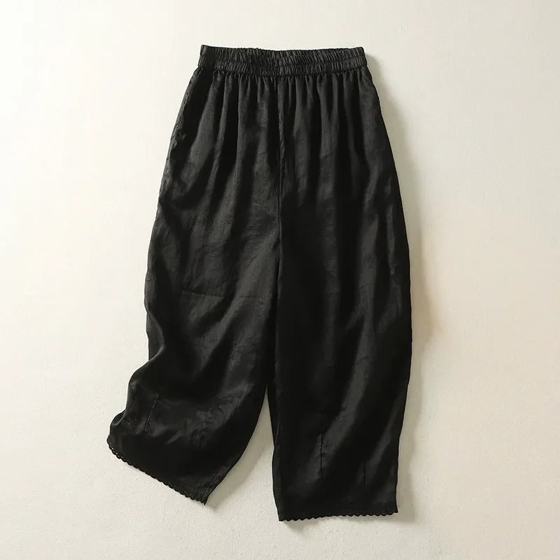 Rhea cropped linen trousers with relaxed fit, soft gathers, and stretch waistband in casual style