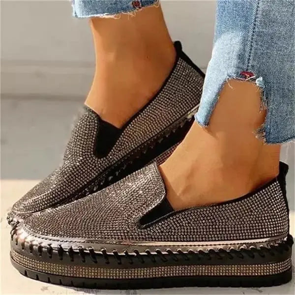Women's white platform slip-on sneakers with rhinestone embellishments and cushioned sole