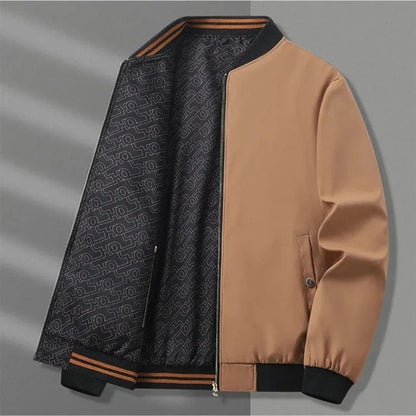 Reversible lightweight jacket with stand collar, elastic cuffs, zippered pockets, solid and bold pattern