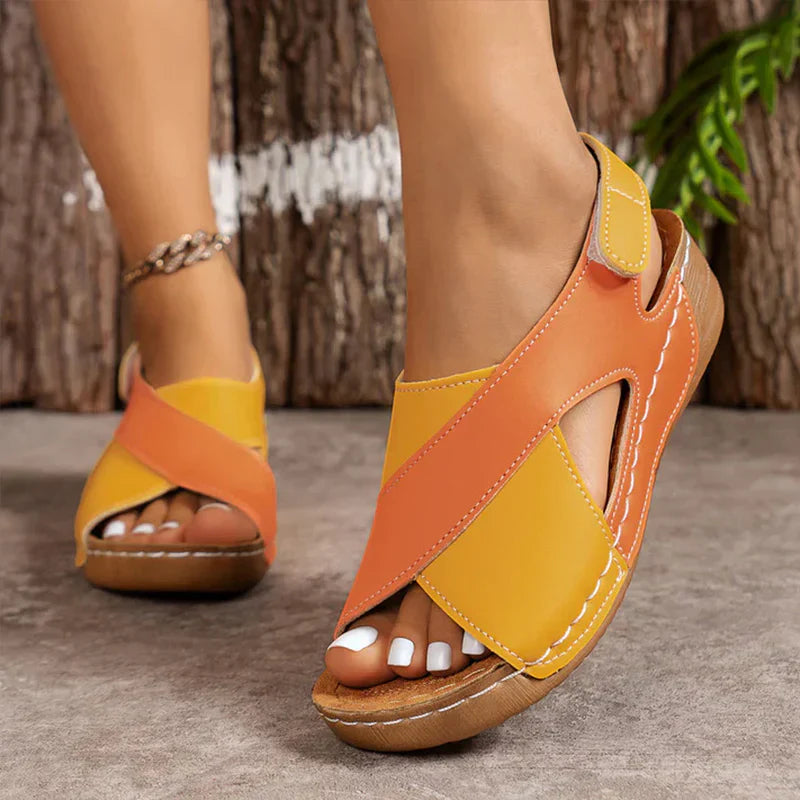 Women's beige open-toe comfort sandals with adjustable slingback strap and contoured cushioned footbed