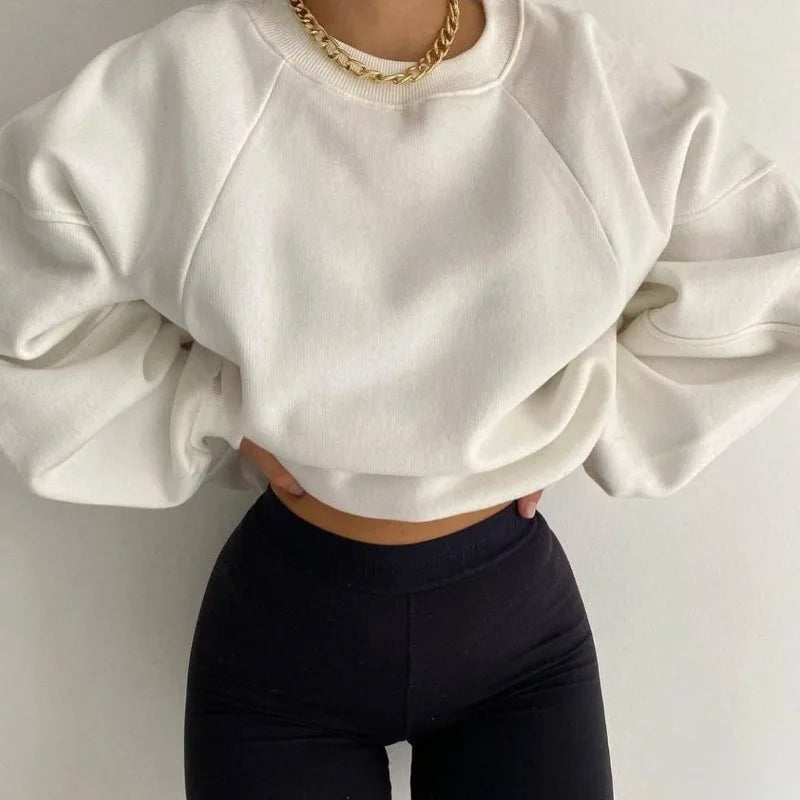 Women's oversized pullover sweatshirt in cozy relaxed fit with dropped shoulders for effortless winter style