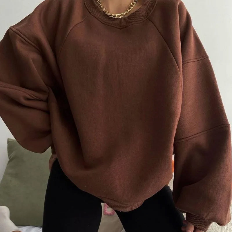 Women's oversized pullover sweatshirt in cozy relaxed fit with drop-shoulder silhouette for effortless winter style
