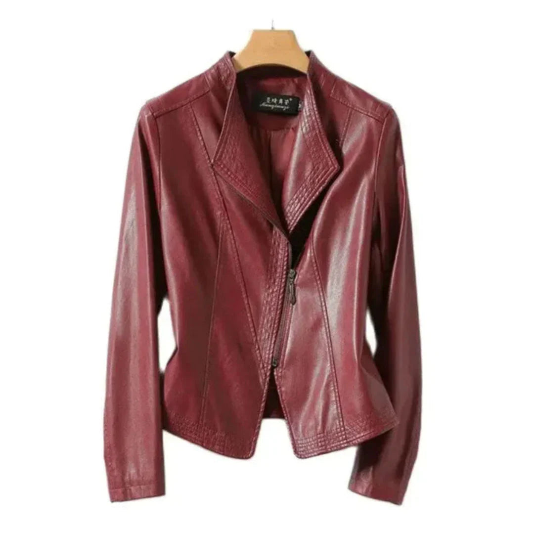 Black leather moto jacket with asymmetrical zip, structured collar, and slim tailored silhouette