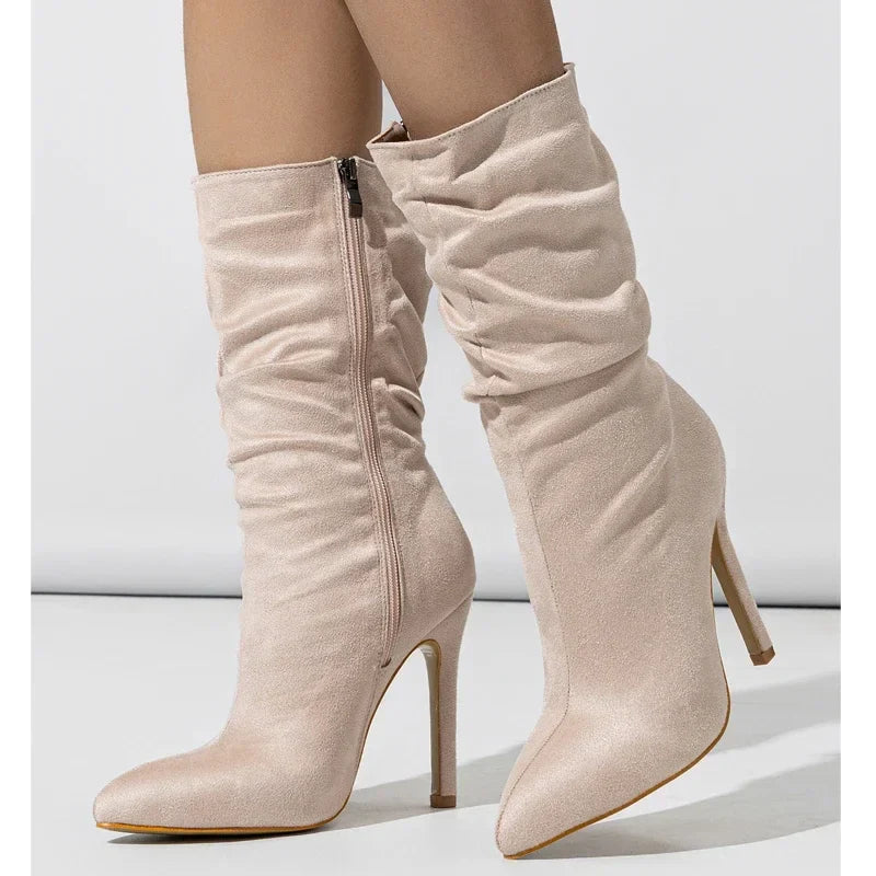 Black velvet stiletto boot with plush finish, sleek heel, and relaxed shaft for elegant evenings