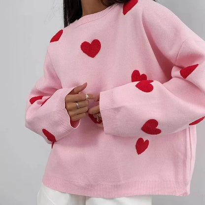 Pink feminine knit sweater with delicate heart pattern detail, soft breathable fabric cozy style