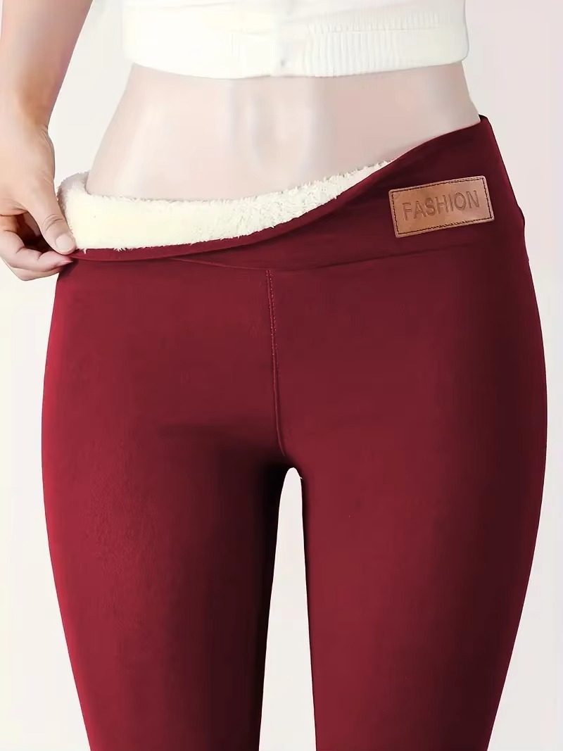 Women's black high-waist thermal plush leggings with fleece lining for cold weather warmth