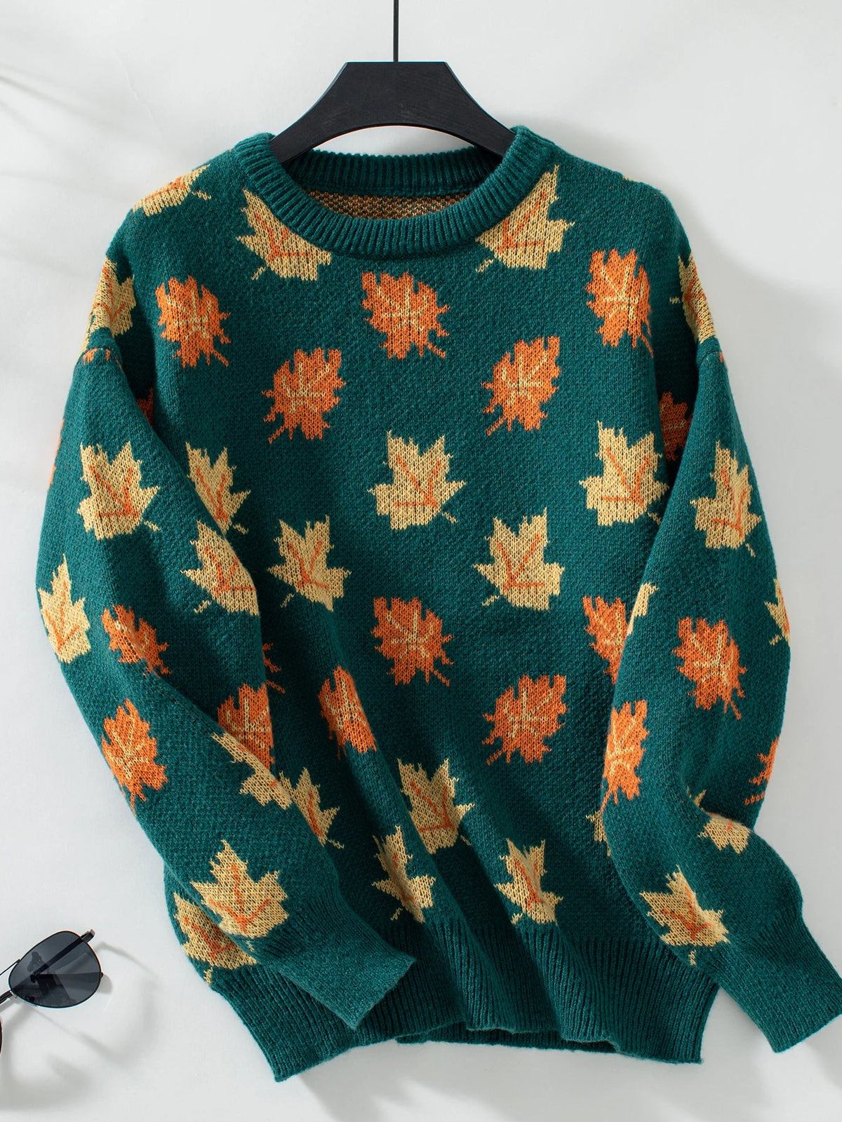 Cozy woven knit pullover sweater with vibrant autumn leaves print, soft elastic cuffs