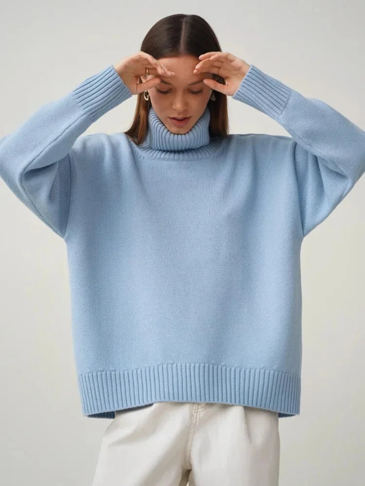 Oversized cream ribbed turtleneck sweater with soft knit blend and relaxed silhouette