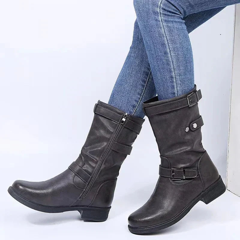 Black ankle-height comfort boots with sleek contoured silhouette and advanced cushioning support