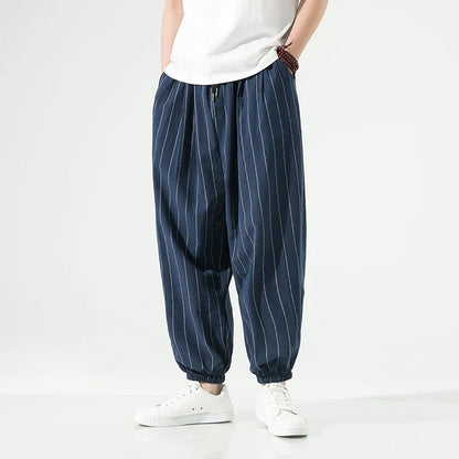 Men's white cotton relaxed-fit pinstripe trousers with elastic waistband by TrendAura