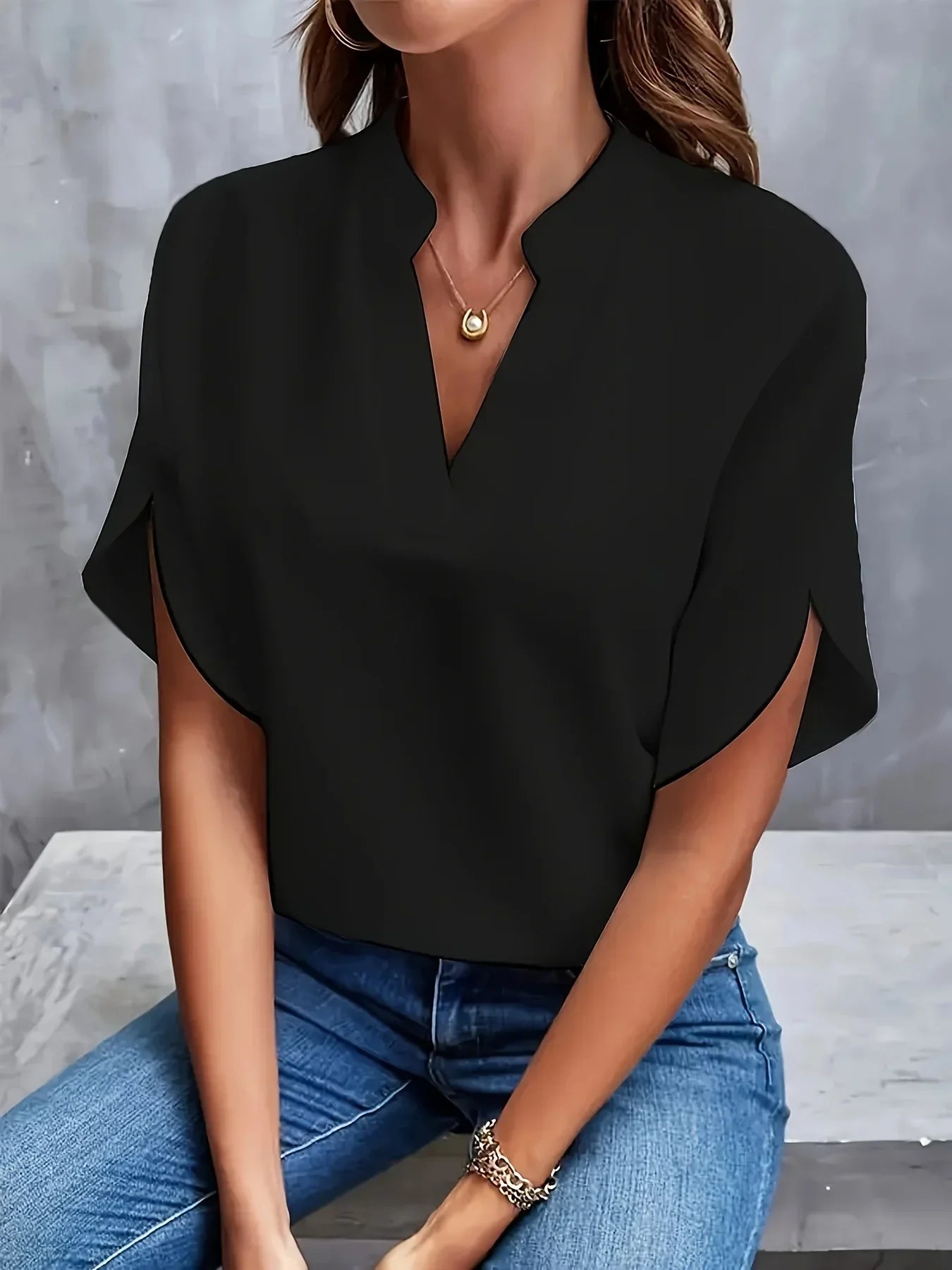 Sophisticated tailored blouse with elegant drape and flattering silhouette cut for versatile wear