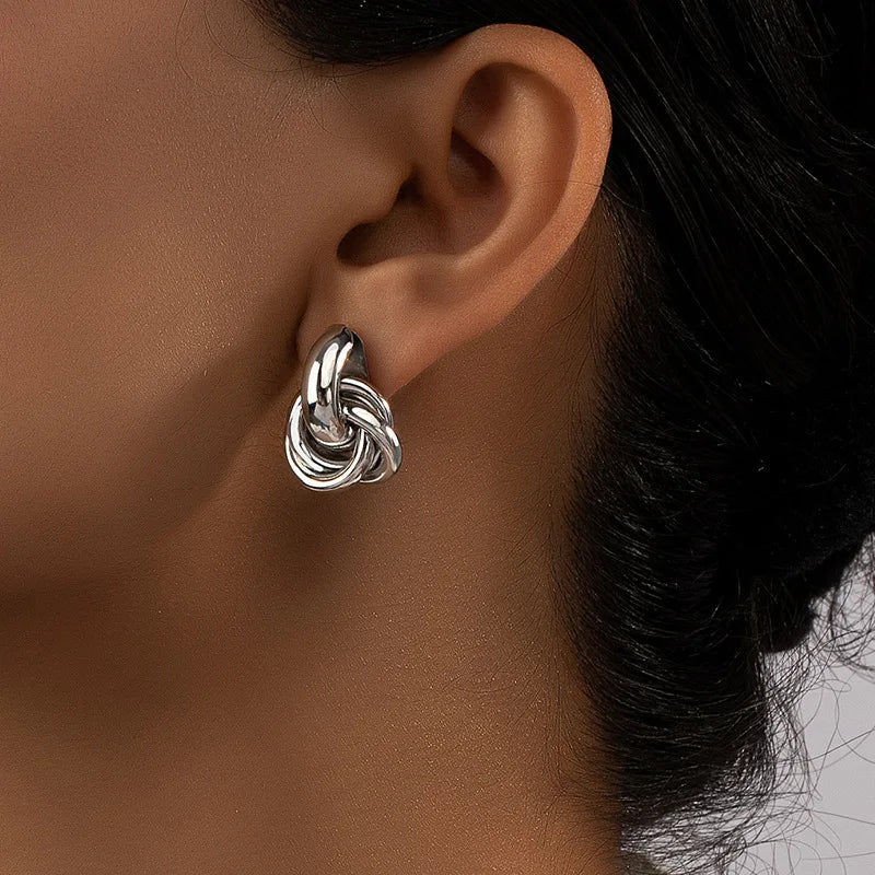 Atomica mini hoop earrings in polished silver, sleek minimalist design with non-tarnish finish