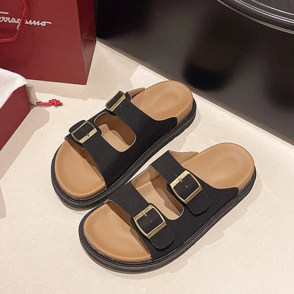 Women's cushioned slip-on buckle sandals with contoured footbed in neutral colorway, effortless slide style
