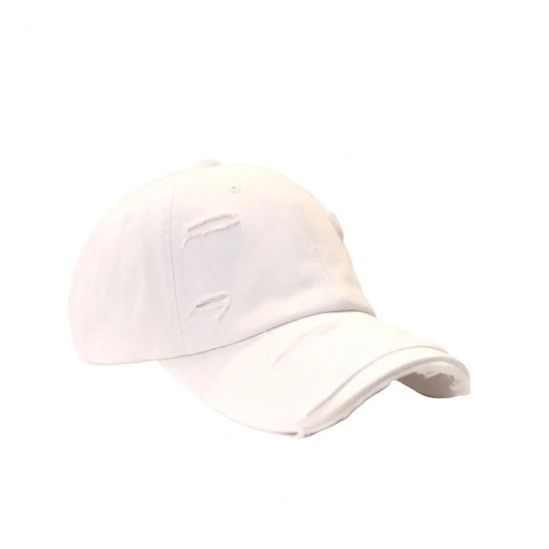 Vintage distressed cotton baseball hat with extended brim and rugged ripped detailing in multiple colors