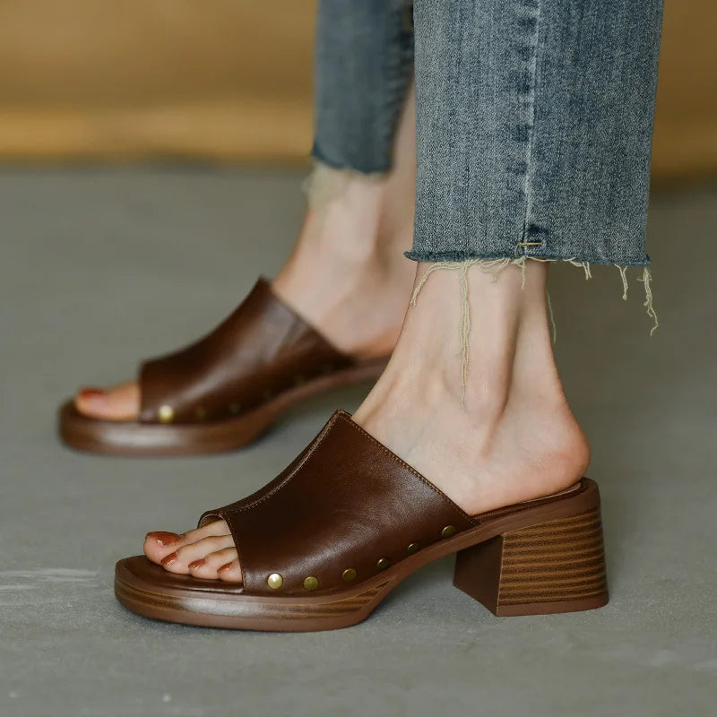 Women's flat sandals minimalist design in neutral tone with sleek silhouette and elegant ankle strap