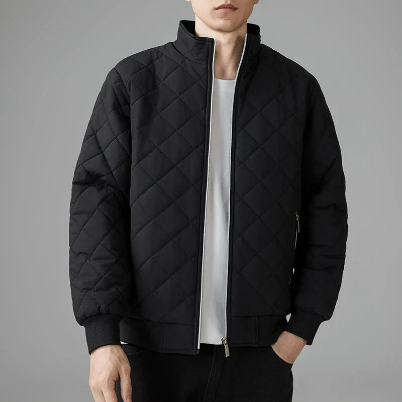 Men's black padded quilted jacket with zipper closure, sleek modern silhouette and lightweight insulation