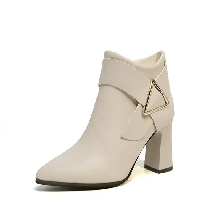Black high heel boots with distinctive triangle buckle detail, sleek contemporary silhouette for women