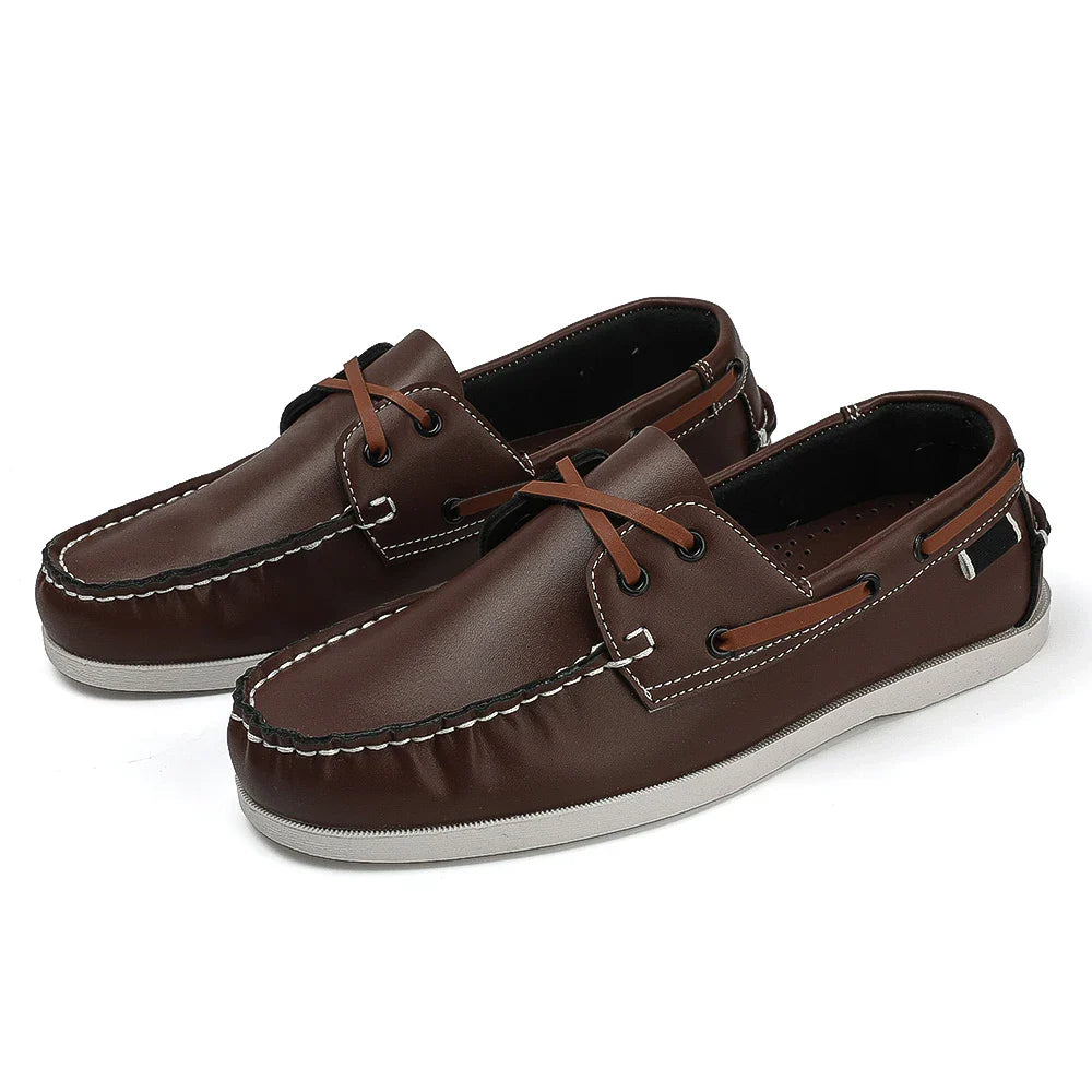 Men's navy two-tone slip-on boat shoes with synthetic leather upper and cushioned EVA foam sole