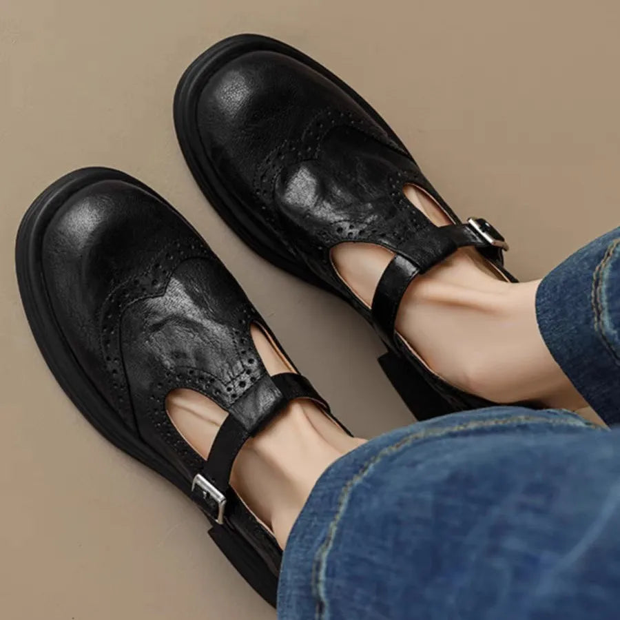 Women's classic leather T-strap shoes in neutral tone with vintage-inspired silhouette and full-grain upper