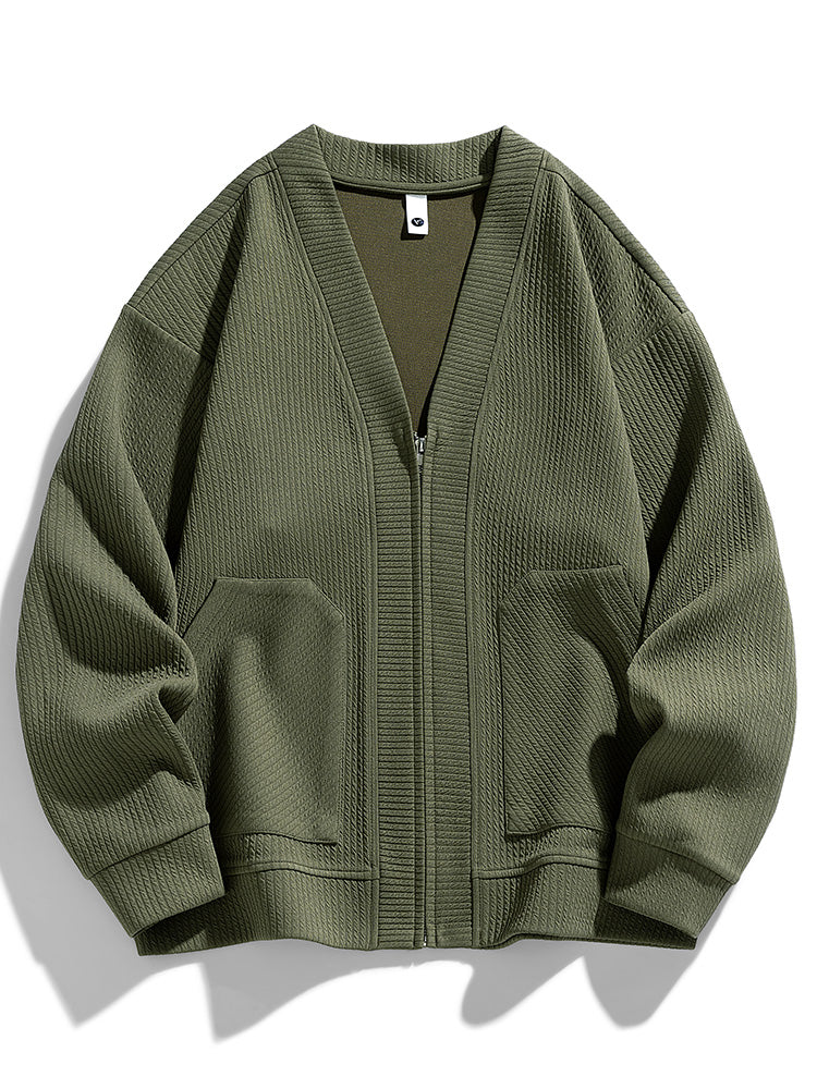Oversized zip-up cardigan in textured cotton blend with relaxed drape and sleek closure