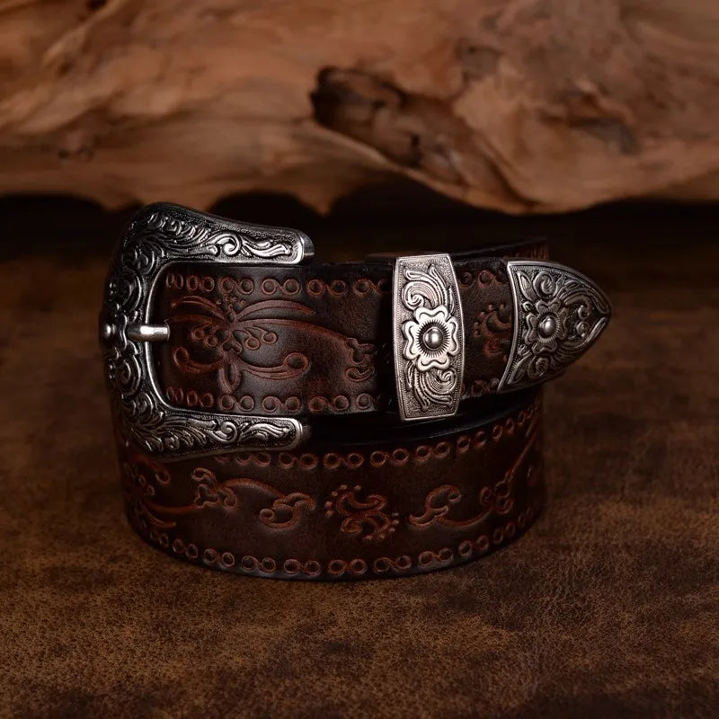 Brown vegan leather western belt with intricate embossed design and solid steel buckle