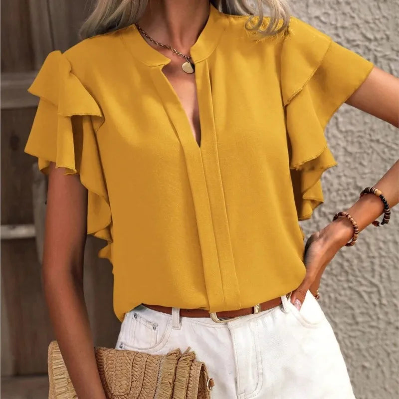 Chic women's blouse with elegant ruffle sleeves, flowing fabric, feminine silhouette in soft neutral tone