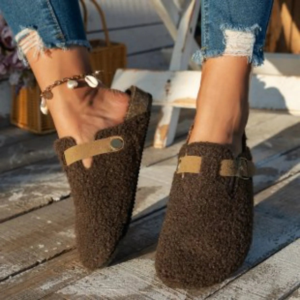 Women's cozy slip-on slippers with plush soft interior lining for warm indoor winter relaxation
