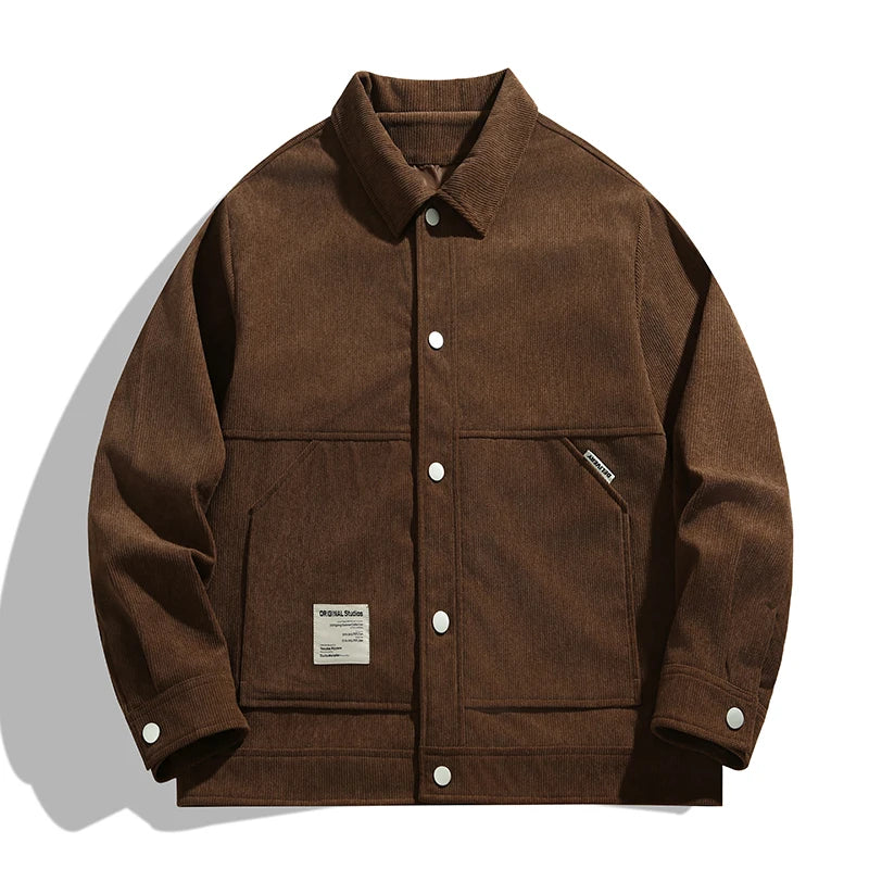 Retro 90s brown corduroy trucker jacket with turn-down collar and textured finish for easy layering