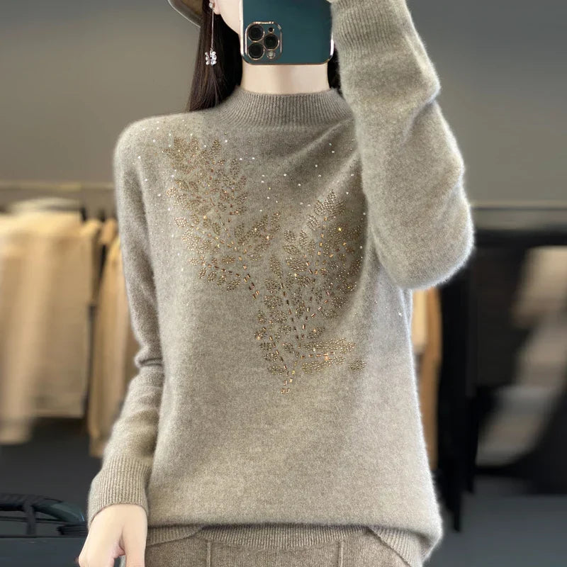 Ivory embellished sweater with delicate crystal details and flattering relaxed silhouette