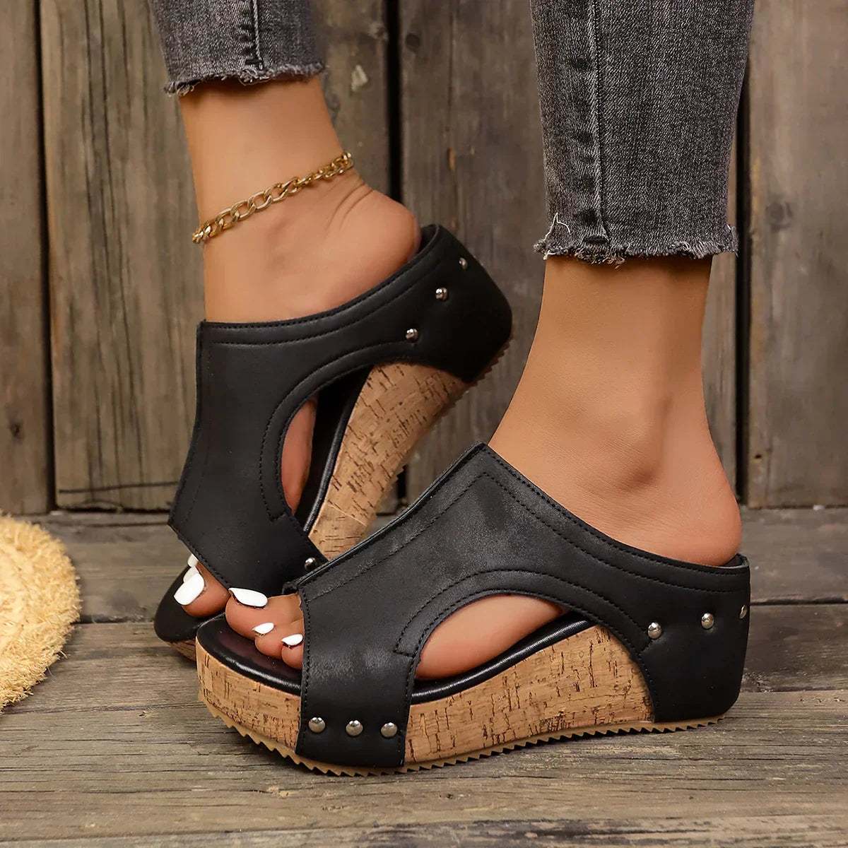 Women's wedge sandals with sleek straps and chic metallic studs for bold elegant style