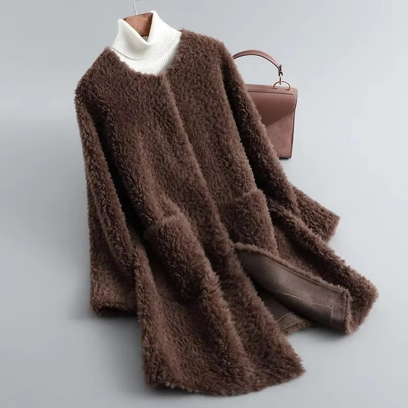 Women's mid-length plush faux lamb fur coat in neutral tone with cozy cardigan-style silhouette