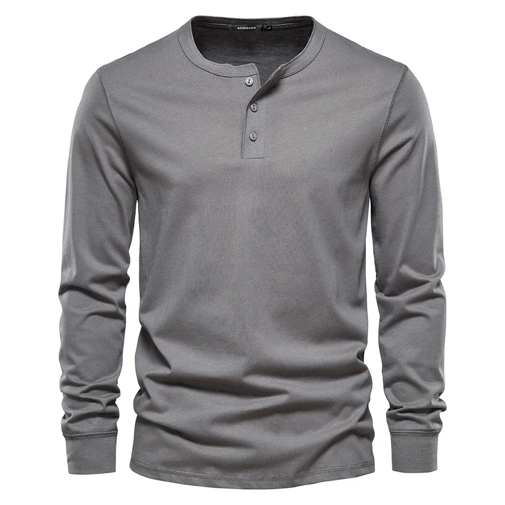 Navy blue men's long sleeve Henley shirt with classic button-up neckline for smart-casual style