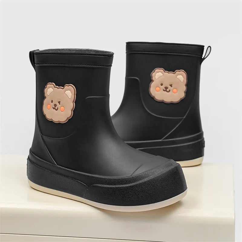 Women's black rubber ankle rain boots with playful bear motif pull-on waterproof design