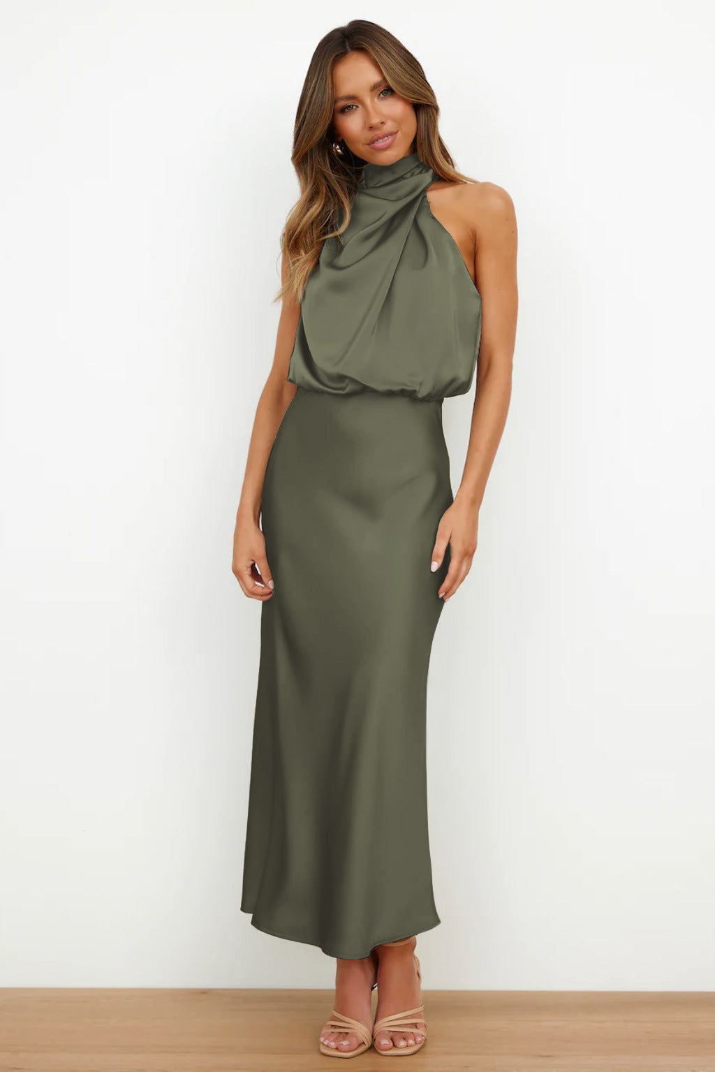 Elegant black satin halter evening dress with flowing silhouette and sleek finish