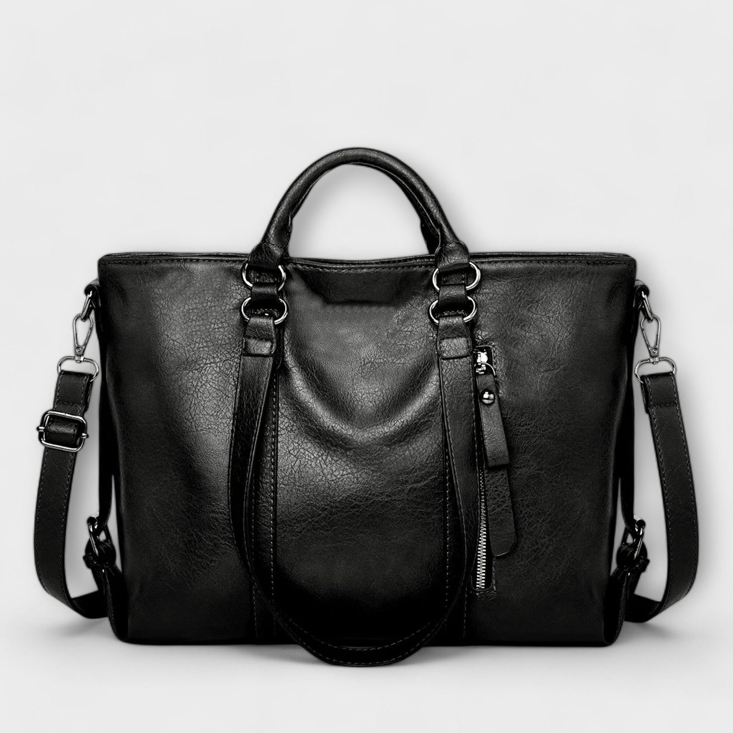Black professional handbag with double handles, adjustable shoulder strap, and spacious main compartment