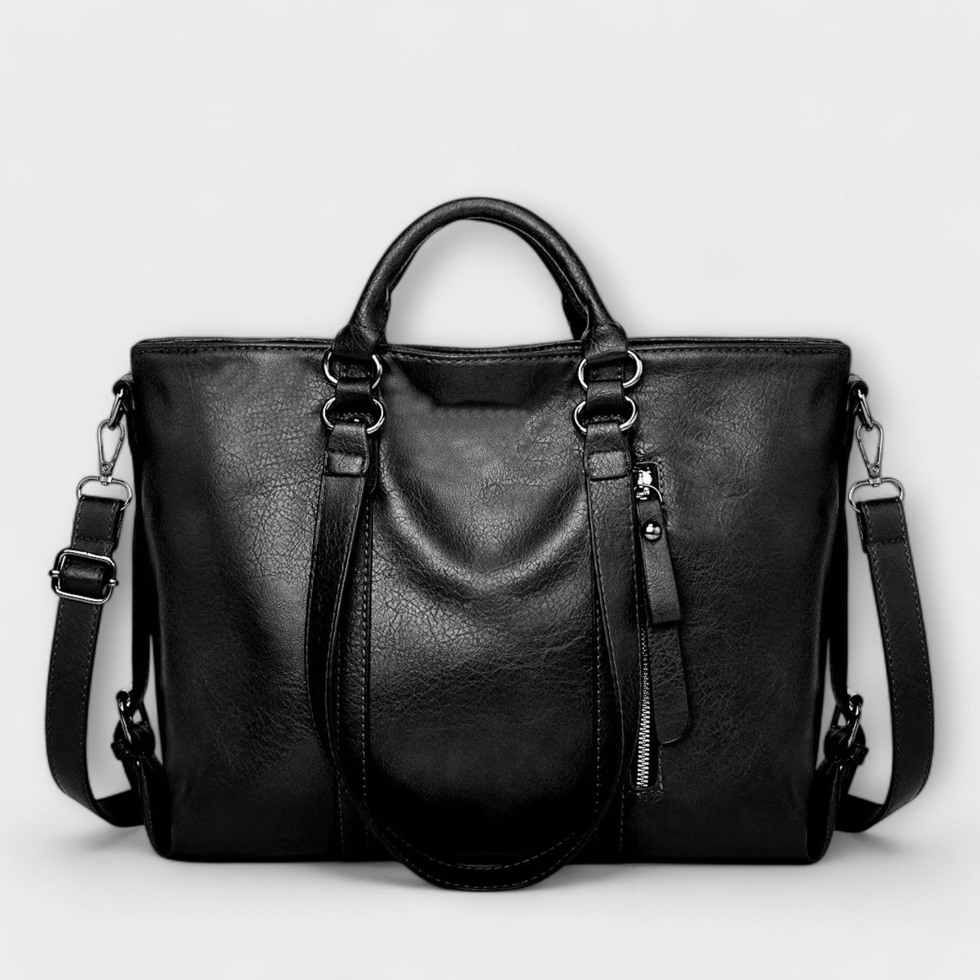 Black professional handbag with double handles, adjustable shoulder strap, and spacious main compartment