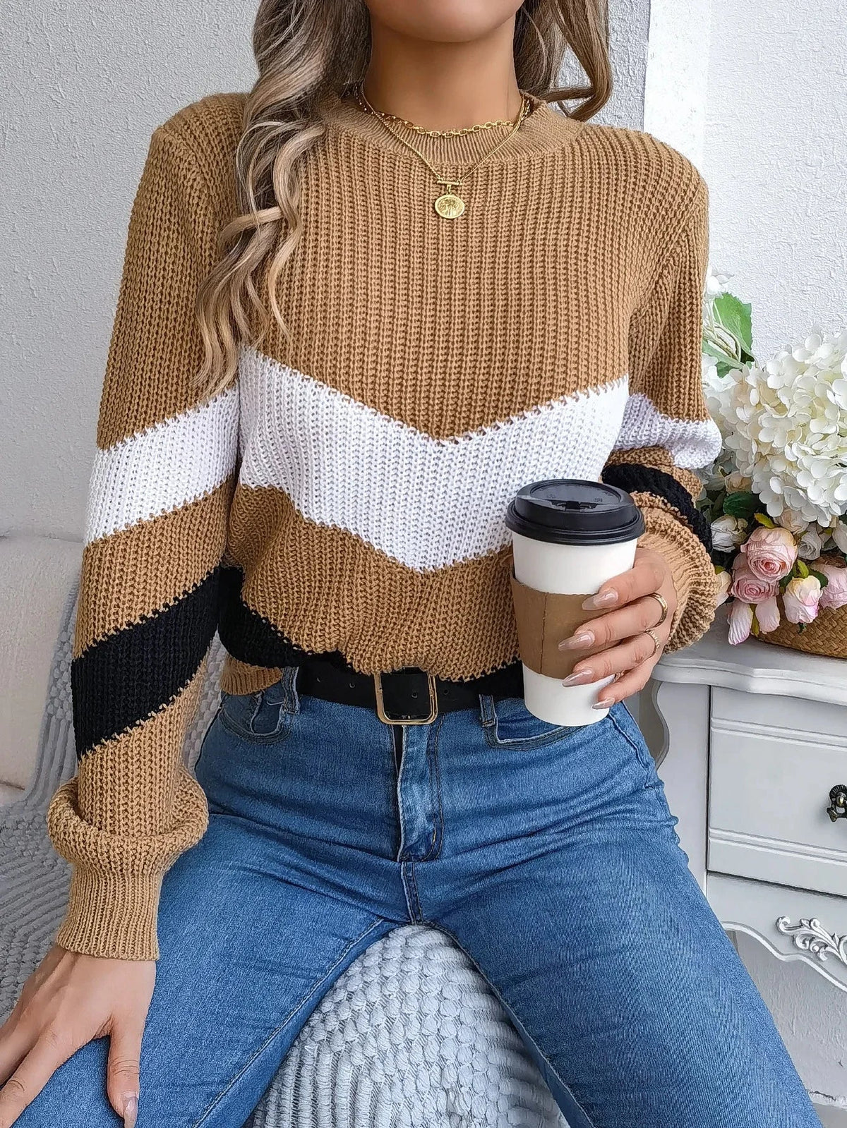 Women's cashmere turtleneck sweater with bold chevron color-block pattern and cozy relaxed fit
