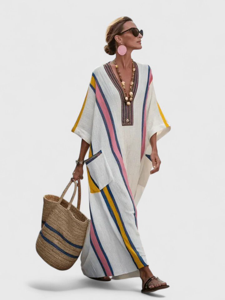 Women's blue stripe kaftan maxi dress with deep V-neckline and flowing resort-style silhouette