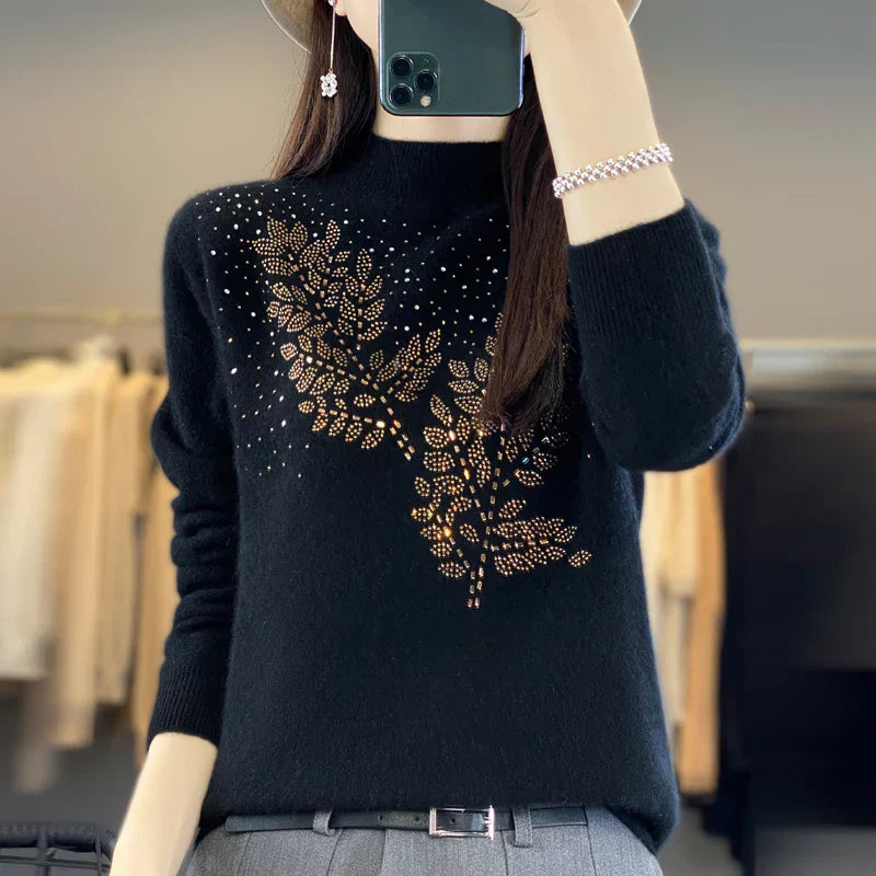 Ivory embellished knit sweater with delicate crystal details and a flattering relaxed silhouette