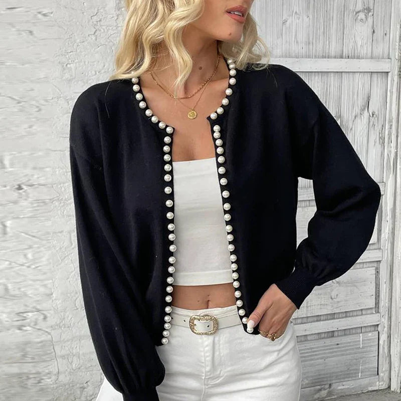 Ivory pearl-lined knit cardigan with maple-leaf jacquard, relaxed fit and ribbed cuffs