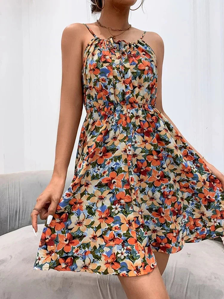 Floral print midi summer dress in vibrant bloom pattern with flowy silhouette and feminine tiered skirt