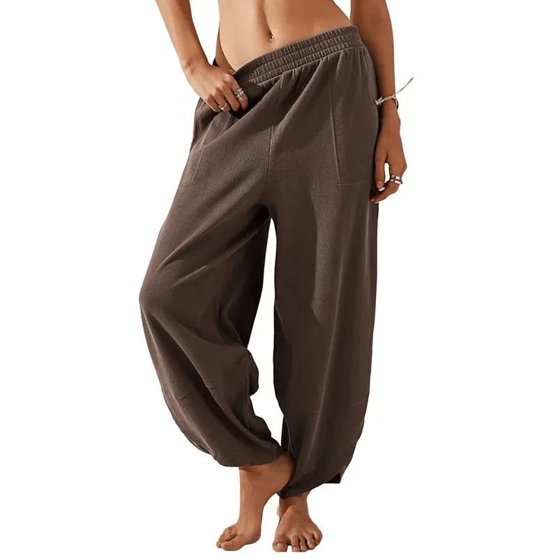 Sophia wide-leg trousers in neutral tone, relaxed fit with elastic waistband for effortless spring style