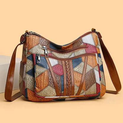 Vegan leather multicolor patchwork shoulder bag with soft slouchy silhouette and geometric design