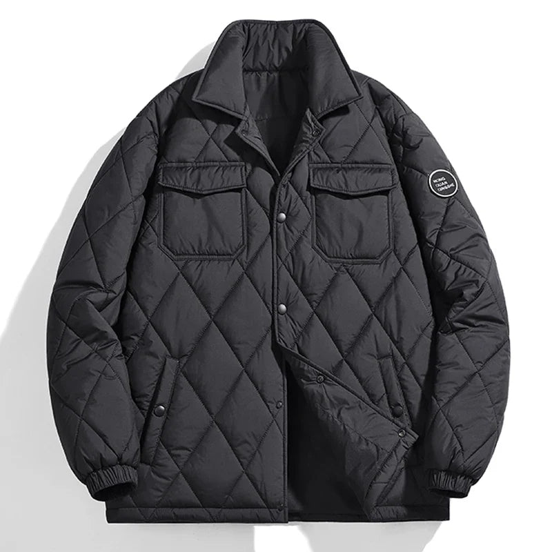 Black quilted puffer winter jacket with stand-up collar, ribbed cuffs, and snap button closure