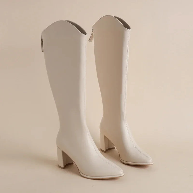 Natalia black faux leather knee-high boot with sleek silhouette and city-chic attitude