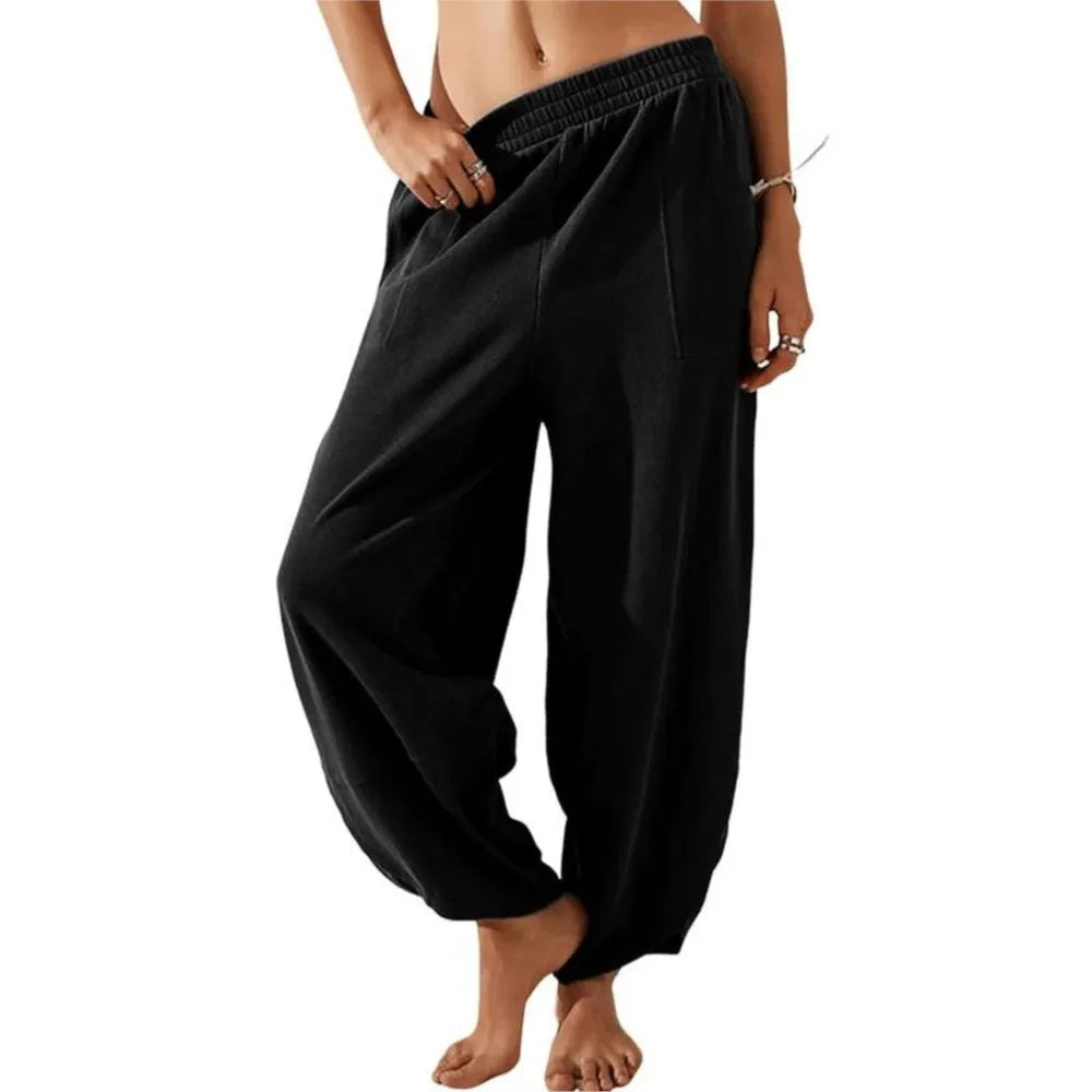 Sophia wide-leg trousers in neutral tone, relaxed fit with elastic waistband for effortless spring style