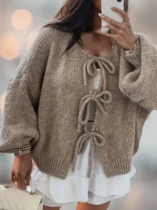 Women's chunky knit cardigan in cozy winter tones with a distinctive knotted front tie detail