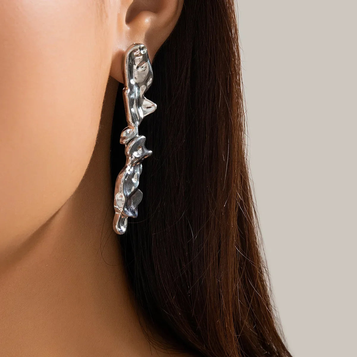 Molten Elegance abstract jewelry set with organic-shaped links in polished gold and silver tones
