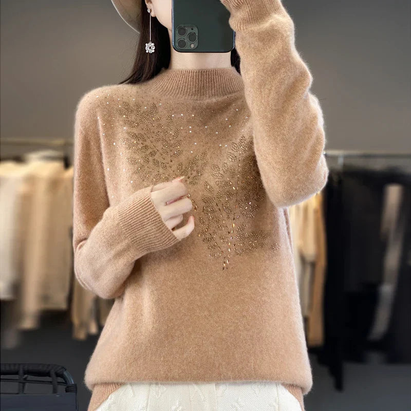 Ivory embellished sweater with delicate details, flattering silhouette, and effortless everyday glamour
