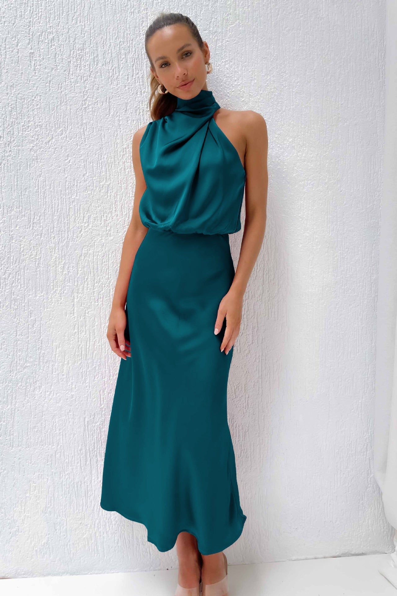 Sleek satin halter evening dress with flowing silhouette in elegant cut for formal occasions